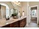 Bright bathroom features a double vanity with granite counters and modern fixtures, next to a large window at 17 Beckwith Ave, Clayton, NC 27527