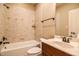 This bathroom features tile surround, a bathtub and shower combination, and granite countertops at 17 Beckwith Ave, Clayton, NC 27527