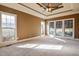 Bedroom with tray ceiling, plush carpet and an abundance of natural light at 17 Beckwith Ave, Clayton, NC 27527