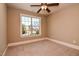 This carpeted bedroom offers plenty of natural light from the window and ample space for furniture at 17 Beckwith Ave, Clayton, NC 27527