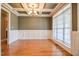 Bright dining room featuring a coffered ceiling, hardwood floors, and wainscoting at 17 Beckwith Ave, Clayton, NC 27527