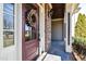 Elegant front door featuring glass panes, a decorative wreath, and stylish hardware at 17 Beckwith Ave, Clayton, NC 27527