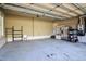 Spacious two-car garage featuring high ceilings, overhead door and ample storage at 17 Beckwith Ave, Clayton, NC 27527