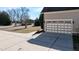 Spacious garage with a double door and driveway, offering ample parking and storage at 17 Beckwith Ave, Clayton, NC 27527