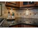 Granite countertops and decorative backsplash create a luxurious cooking space at 17 Beckwith Ave, Clayton, NC 27527