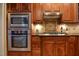 Gourmet kitchen boasting stainless steel appliances and custom wood cabinetry at 17 Beckwith Ave, Clayton, NC 27527