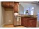 Modern kitchen with granite counters, wood cabinets and stainless steel dishwasher at 17 Beckwith Ave, Clayton, NC 27527