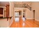 Open-concept living area with staircase and views to the dining room at 17 Beckwith Ave, Clayton, NC 27527