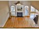 Spacious living room showcasing a fireplace, arched windows, and hardwood flooring at 17 Beckwith Ave, Clayton, NC 27527