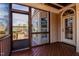 Inviting screened porch with wood flooring and views of the serene backyard and neighborhood at 17 Beckwith Ave, Clayton, NC 27527