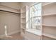 Bright walk-in closet offers custom shelving, ample storage space, and a window to allow natural light at 17 Beckwith Ave, Clayton, NC 27527