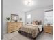 Cozy bedroom with a decorative dresser, side tables, and natural light from two windows at 173 Monteith Dr, Chapel Hill, NC 27516