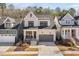 Charming home featuring stone accents, a covered porch, and a convenient attached two-car garage at 173 Monteith Dr, Chapel Hill, NC 27516