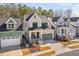 Attractive home featuring stone accents, a covered porch, and a convenient attached two-car garage at 173 Monteith Dr, Chapel Hill, NC 27516