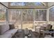 Comfortable screened-in patio with outdoor seating and wooded views at 173 Monteith Dr, Chapel Hill, NC 27516