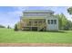 Back exterior featuring a large, covered porch and backyard views at 1783 Ballard Rd # Apex Georgian, Fuquay Varina, NC 27526