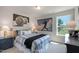 Well-lit bedroom with baseball decor and a plush, patterned bedspread at 1783 Ballard Rd # Apex Georgian, Fuquay Varina, NC 27526