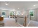 Spacious bonus room features comfortable seating, natural light, and a neutral palette at 1783 Ballard Rd # Apex Georgian, Fuquay Varina, NC 27526