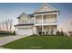 Stunning two-story home with a spacious front yard, covered porch and a two-car garage at 1783 Ballard Rd # Apex Georgian, Fuquay Varina, NC 27526