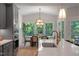 Open-concept kitchen featuring stainless appliances, custom cabinets and a view into the dining area at 1783 Ballard Rd # Apex Georgian, Fuquay Varina, NC 27526