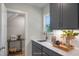 Convenient kitchenette featuring custom cabinets, sink, quartz countertops and designer fixtures at 1783 Ballard Rd # Apex Georgian, Fuquay Varina, NC 27526