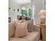 Bright living room with comfortable sofa, decorative pillows, accent table and a view into the dining area at 1783 Ballard Rd # Apex Georgian, Fuquay Varina, NC 27526