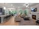 Spacious open-concept living room featuring a fireplace, comfortable seating, and seamless kitchen access at 1783 Ballard Rd # Apex Georgian, Fuquay Varina, NC 27526