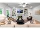 Bright living room boasts built-in shelving, cozy fireplace, and contemporary furnishings at 1783 Ballard Rd # Apex Georgian, Fuquay Varina, NC 27526