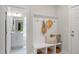 Welcoming mudroom boasts built-in storage, decorative accents, and convenient access to bathroom at 1783 Ballard Rd # Apex Georgian, Fuquay Varina, NC 27526