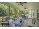 Spacious covered porch with comfortable seating and serene outdoor view at 1783 Ballard Rd # Apex Georgian, Fuquay Varina, NC 27526