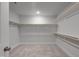 Spacious walk-in closet with ample shelving and hanging space for organization at 1783 Ballard Rd # Apex Georgian, Fuquay Varina, NC 27526