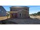 Rear exterior view of a two-story home with covered patio at 1803 Ballard Rd # Holly Craftsman, Fuquay Varina, NC 27526