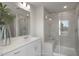 Bathroom featuring double sinks, large mirror, and a separate glass shower at 1803 Ballard Rd # Holly Craftsman, Fuquay Varina, NC 27526