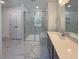 Bathroom featuring marble tile floors, a glass enclosed shower, and a dark vanity with drawers at 1803 Ballard Rd # Holly Craftsman, Fuquay Varina, NC 27526