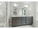 Double sink bathroom with gray cabinets, a large mirror, and elegant marble countertops at 1803 Ballard Rd # Holly Craftsman, Fuquay Varina, NC 27526
