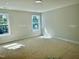 Bright, empty bedroom with two windows providing natural light at 1803 Ballard Rd # Holly Craftsman, Fuquay Varina, NC 27526