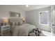 This cozy bedroom provides a serene retreat with plush carpets, abundant natural light, and charming decor at 1803 Ballard Rd # Holly Craftsman, Fuquay Varina, NC 27526