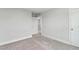 Neutral bedroom with plush carpet, base molding, and a closet at 1803 Ballard Rd # Holly Craftsman, Fuquay Varina, NC 27526