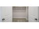 An open closet, showing the rod for hanging clothes at 1803 Ballard Rd # Holly Craftsman, Fuquay Varina, NC 27526