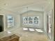 Open dining area with vaulted ceiling, modern lighting, and natural light from windows at 1803 Ballard Rd # Holly Craftsman, Fuquay Varina, NC 27526