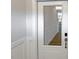 Bright entryway showcasing white wainscoting and a glass panel door with wood-look floors at 1803 Ballard Rd # Holly Craftsman, Fuquay Varina, NC 27526