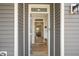 The entryway showcases a view through to the living room with beautiful wood flooring at 1803 Ballard Rd # Holly Craftsman, Fuquay Varina, NC 27526