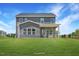 This lovely home features a spacious backyard with a covered patio and lush greenery at 1803 Ballard Rd # Holly Craftsman, Fuquay Varina, NC 27526