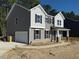 Two-story home featuring gray siding, a two-car garage, and a walkway to the front door at 1803 Ballard Rd # Holly Craftsman, Fuquay Varina, NC 27526