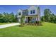 Charming two-story home featuring a welcoming entrance, a two car garage and landscaped front yard at 1803 Ballard Rd # Holly Craftsman, Fuquay Varina, NC 27526