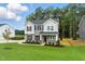 Beautiful two-story home with landscaped front yard and gray siding and well manicured lawn at 1803 Ballard Rd # Holly Craftsman, Fuquay Varina, NC 27526