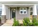 Charming front porch with stone accents, craftsman columns and nice landscaping at 1803 Ballard Rd # Holly Craftsman, Fuquay Varina, NC 27526