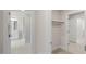 A hallway that leads to the bathroom and to a closet with an open door at 1803 Ballard Rd # Holly Craftsman, Fuquay Varina, NC 27526