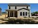 Newly constructed home exterior with gray siding, bright white trim, and a cozy back porch at 1803 Ballard Rd # Holly Craftsman, Fuquay Varina, NC 27526