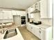 Modern kitchen featuring white cabinets, stainless steel appliances, and a stylish backsplash at 1803 Ballard Rd # Holly Craftsman, Fuquay Varina, NC 27526